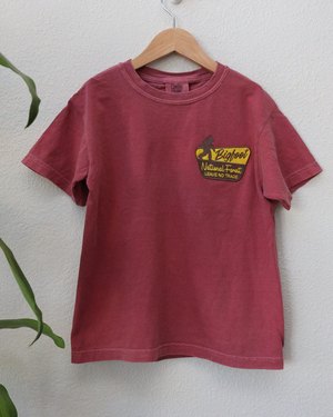 Red kids tee with the Bigfoot National Forest badge embroidered on the left chest
